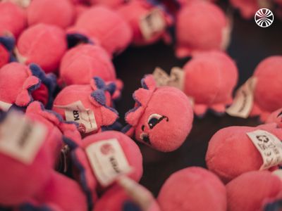 Collection of pink octopus plush toys, part of office branding and decor.