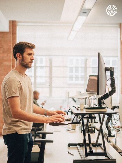 Man working at a standing desk.